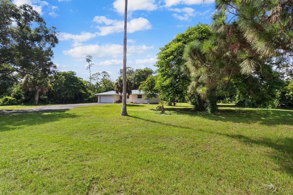 Photo of 16790 E Glasgow Drive, Loxahatchee Groves, FL 33470 (MLS # R11112401)