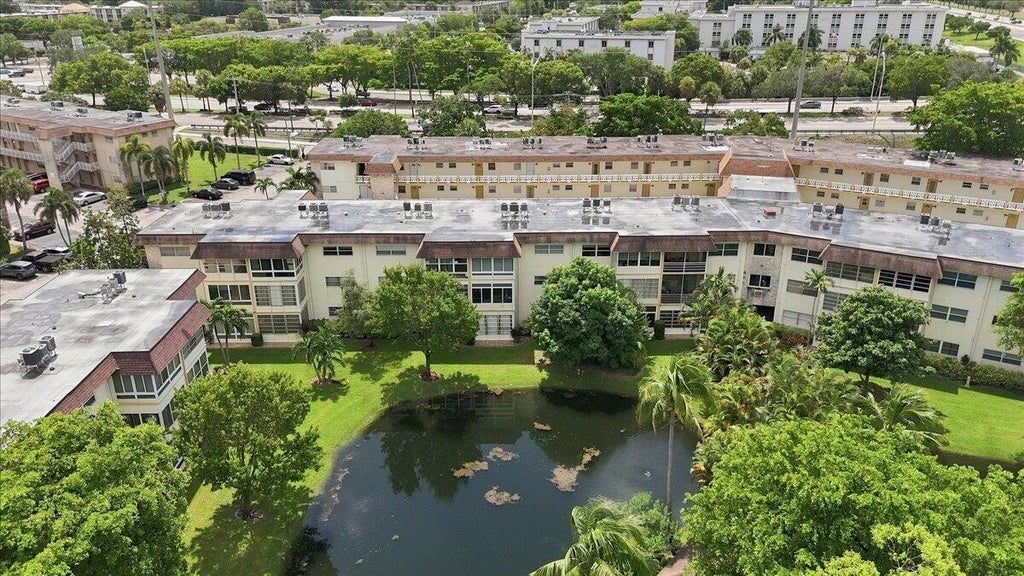 Photo of 5121 W OAKLAND PARK BLVD #109, Lauderdale Lakes, FL 33313 (MLS # B26073879)