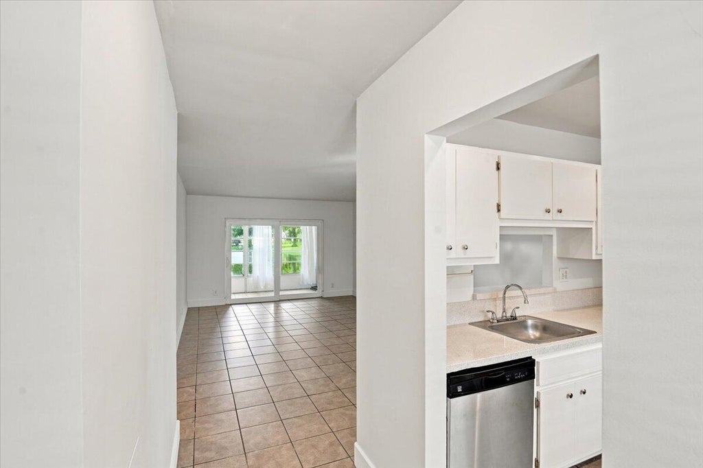 Photo of 5121 W OAKLAND PARK BLVD #109, Lauderdale Lakes, FL 33313 (MLS # B26073879)