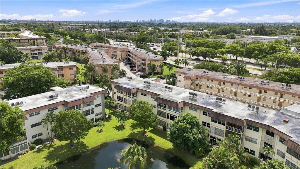 Photo of 5121 W OAKLAND PARK BLVD #109, Lauderdale Lakes, FL 33313 (MLS # B26073879)