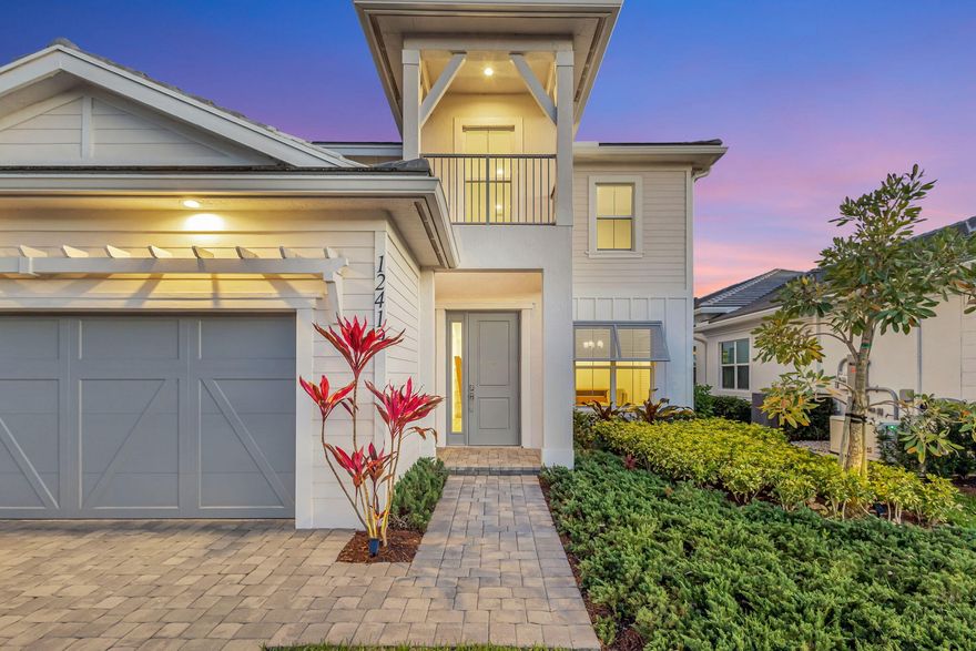 Waterfront living meets effortless luxury in this fully upgraded two-story pool home in the exclusive Windgate community of Avenir. Perfectly positioned on a private lakefront homesite, this residence offers stunning water views, exceptional outdoor living, and a flexible layout designed for today's lifestyle. Inside, bright open living spaces are complemented by two versatile flex rooms ideal for a home office, den, fitness studio, or media room. Thoughtfully designed for both everyday comfort and entertaining, the home blends style and functionality throughout. The outdoor setting is truly special. An expansive covered terrace with a fully equipped summer kitchen overlooks the sparkling pool and peaceful waterfront, creating the ultimate space for entertaining or relaxing year-round.  Lush privacy landscaping and a fully fenced yard provide both beauty and seclusion. Additional highlights include a three-car garage, generous bedroom suites, and high-end upgrades throughout. Located in the heart of Avenir, residents enjoy resort-style amenities, scenic nature preserves, miles of trails, and convenient access to Palm Beach Gardens' premier shopping, dining, golf, and beaches. A rare opportunity to own a move-in-ready waterfront pool home in one of Avenir's most sought-after communities.