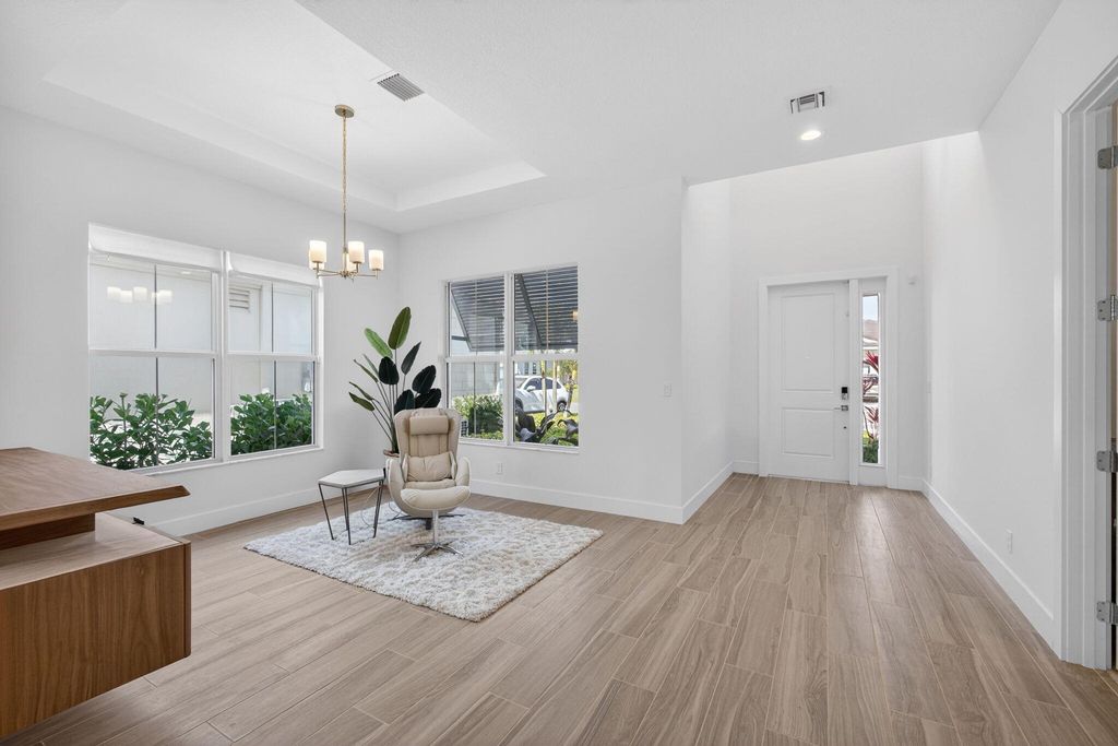 Photo of 12419 Nautilus Cir, Palm Beach Gardens, FL 33412 (MLS # B26000894)