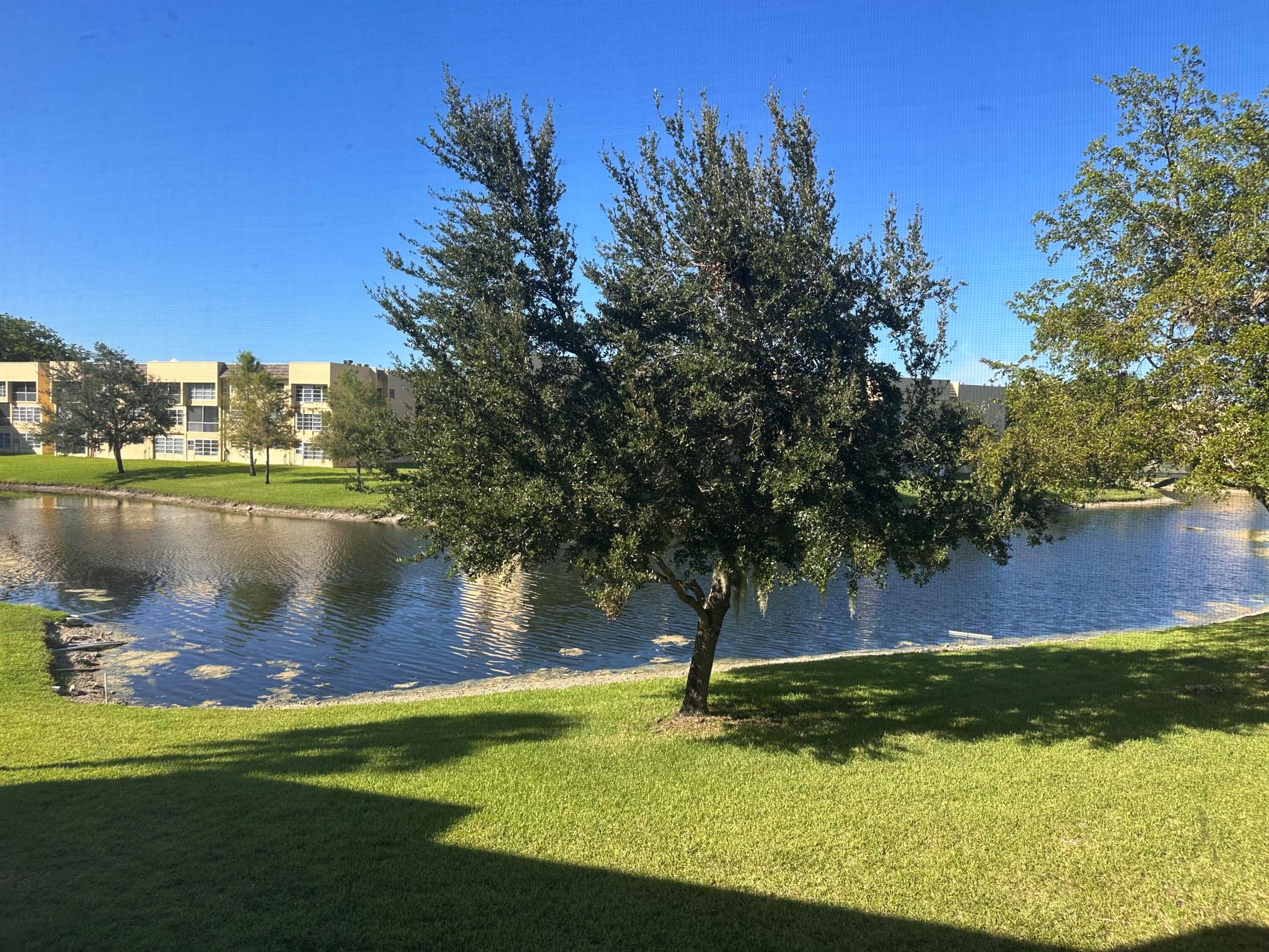 Spectacular lake view! Great opportunity to create your dream home. This 2 bedroom, 2 bathroom home is located in a 55+ community and needs some TLC. The unit is conveniently located next to the pool and offers a beautiful lake view. The HOA requires a minimum credit score of 675 and 20% down for financing. A minimum annual income of $30,000 is required. HOA has strong financials.