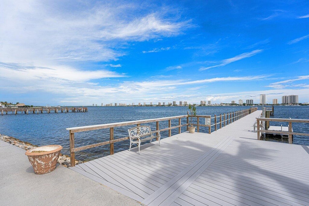 Photo of 3040 Lake Shore Drive #502, Riviera Beach, FL 33404 (MLS # B26088241)