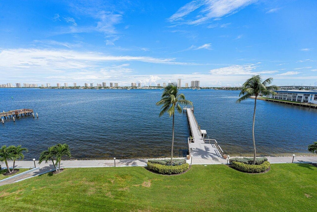 Photo of 3040 Lake Shore Drive #502, Riviera Beach, FL 33404 (MLS # B26088241)