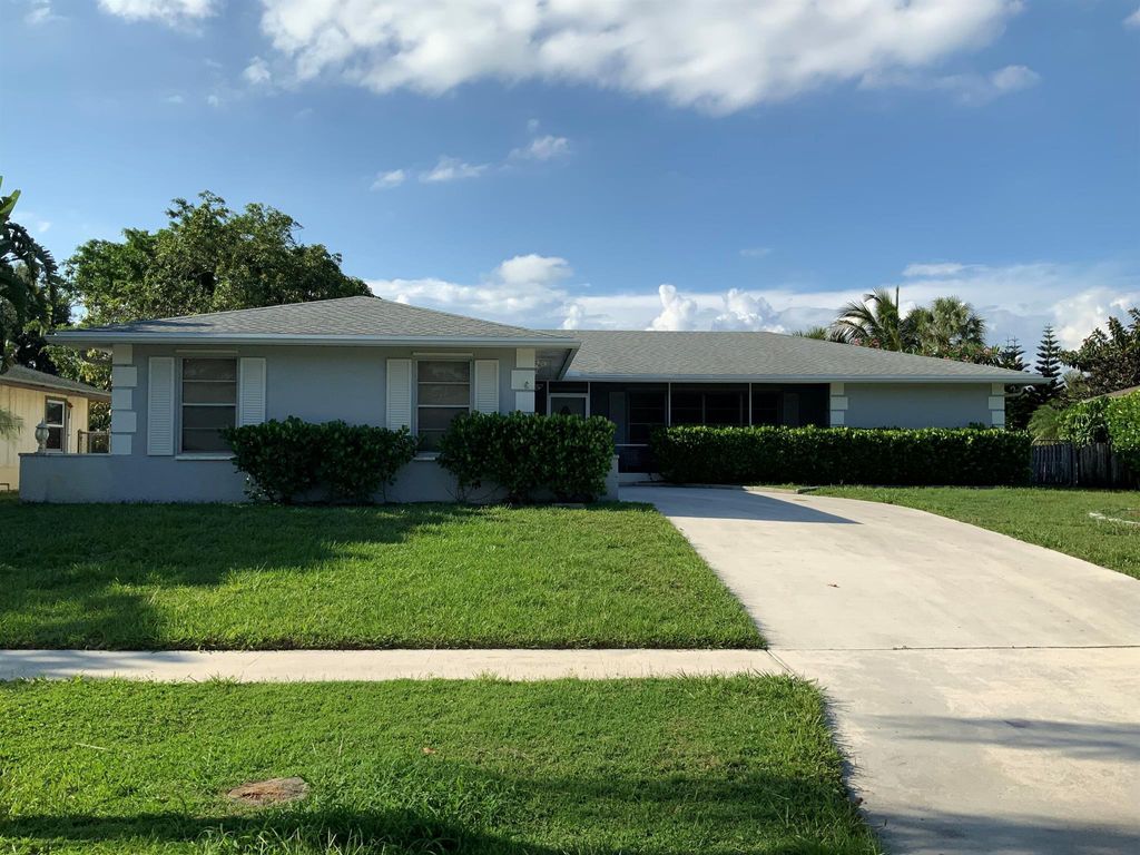 Photo of 2518 Canterbury Drive N, Riviera Beach, FL 33407 (MLS # R10896347)