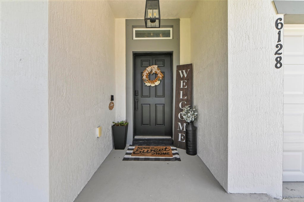Photo of 6128 NW DENSAW Terrace, Port Saint Lucie, FL 34986 (MLS # B26085118)