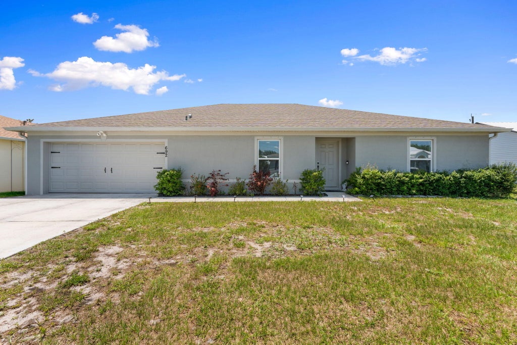 Photo of 692 SW Hamberland Avenue, Port Saint Lucie, FL 34953 (MLS # B26028608)