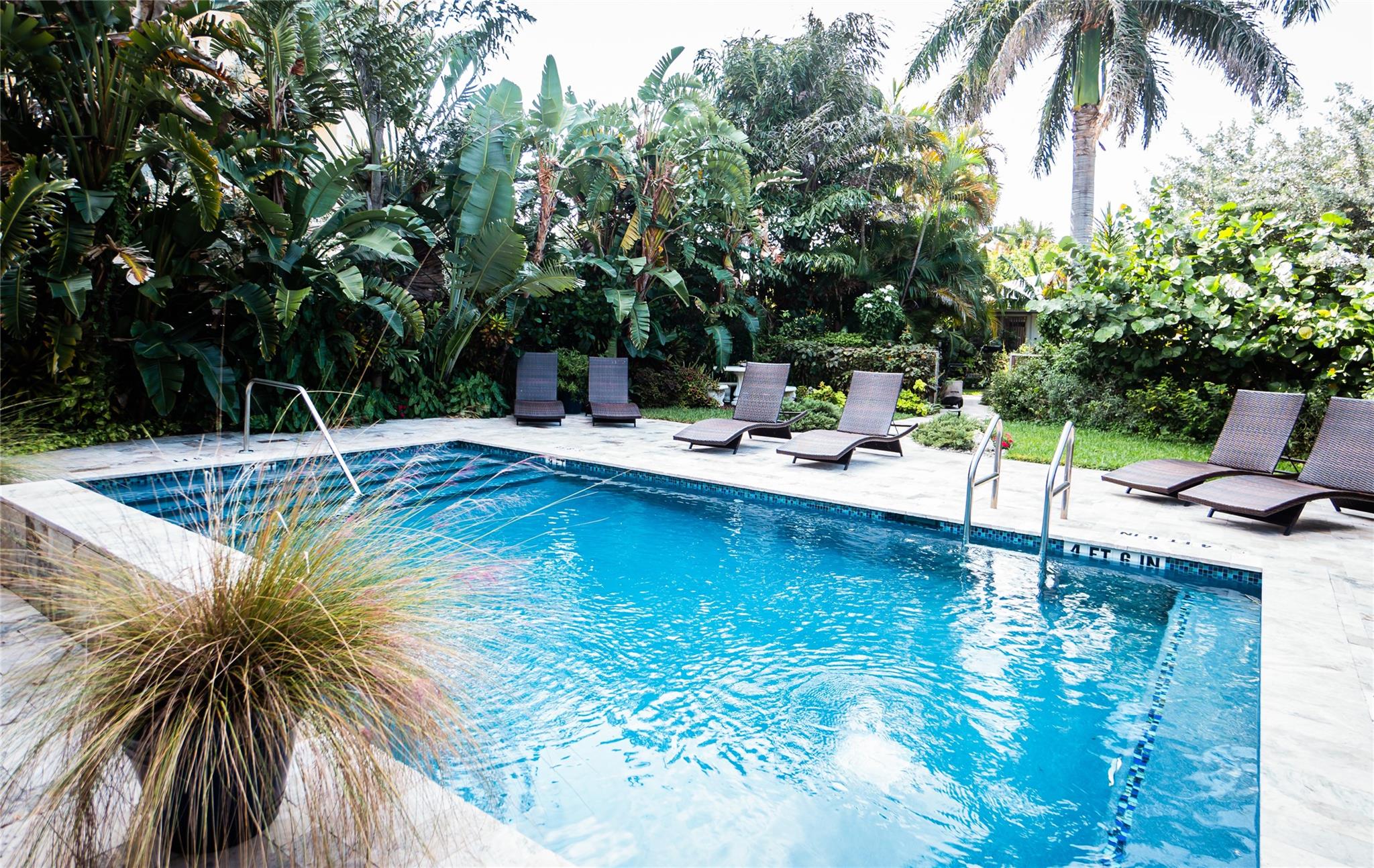 Welcome to this turn-key 7-unit Airbnb/Boutique Hotel BOASTING $230,000 of NOI in 2024 w/ just a 3-min walk to the beach & 3-min drive to Pompano Beach Fishing Village. NEW ROOF & FULL IMPACT WINDOWS. Features resort-style pool, certified butterfly garden & lush tropical landscaping. 8 parking spaces. All units recently remodeled; 5 with private hot tubs. 6 of 7 units have central A/C & one has a mini split. Steps from Fort Lauderdale/Pompano Beach Water Taxi (Indian Mound stop). Prime location—6 min to Lauderdale-by-the-Sea & 7 min to Old Pompano. Proven income-producing property in one of South Florida’s hottest short-term rental markets—ideal for investors seeking strong returns & boutique hospitality. On site property manager & landscaper. See 2024 PROFIT & LOSS report in attachments.