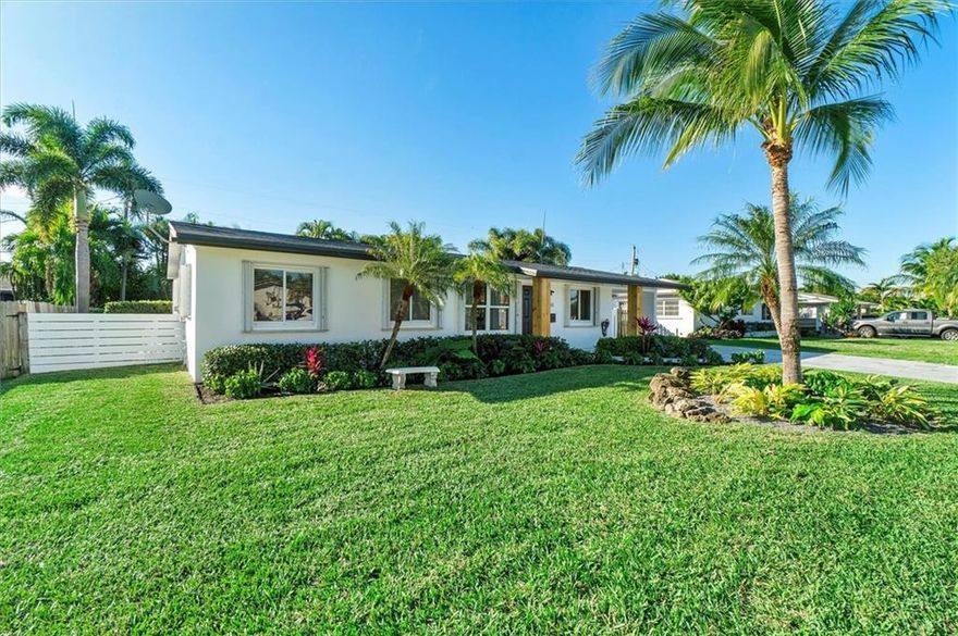 Located East of US-1 in Pompano Beach, this 4 bedroom split floor plan home is perfect for a primary residence or a vacation home as it is being offered fully furnished. This home has it all, new impact windows and doors throughout as well as brand new vinyl floors and trim. Both bathrooms have new vanities, mirrors, and plumbing fixtures. The kitchen features beautiful quartz countertops, newer appliances, and an oversized sink that looks over the pool/ covered patio area. Outside you will find recently done lush landscaping, fresh exterior paint, a brand new driveway, and pool deck! The whole family will enjoy the gorgeous yard and pool! The owners have also installed a security system with cameras and digital front door lock. Less than 10 minutes to the beach! Don't miss this!