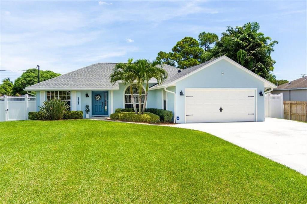 Photo of 2425 SE Cooper Lane Ln, Port Saint Lucie, FL 34984 (MLS # R10829430)