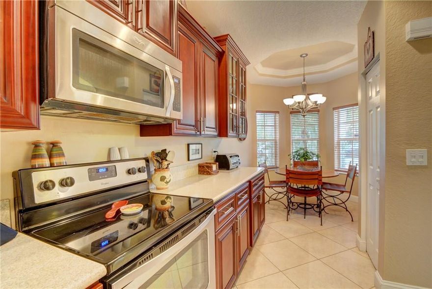 FHA welcome! Looking for Magnificent, you found it in this 3/2 home in the man gated community of Regency Lakes. This house features 42" soft-close wood cabinets, crown molding, SS appliances, huge extended screened-in patio w/tile floors, new laminate in bedrooms, tile on diagonal in living area, new A/C & water heater, upgraded bathrooms and stamped concrete driveway. Maintenance includes basic cable, lawn care, tree trimming, community pool, fitness center, playground, tennis & volleyball courts.
