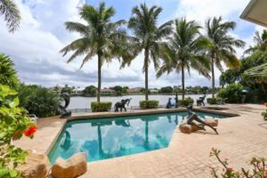 Fantastic opportunity! One of the largest waterfront homes on the exclusive Island of Manalapan at the lowest price per sq ft!! 1 MILLION UNDER ZILLOW VALUE! PLUS Free memb to the Exclusive Eau Palm Beach Country club ( Ritz Carlton)This home has everything you could want! Luxurious 5 bedrooms 7 baths plus Office/Den & Family room & Extra Florida room!Outdoor kichen Marble floors, Vaulted Ceilings! Huge Pool & Hot tub. Brick paved patio Large gourmet Kitchen remodeled 2 years ago with granite counters & custom wood cabinets. Marble frpl, sunken wetbar! Delux oversized master suite with morning kitchen, spa tub & shower. Excellent floor plan, lushly landscaped and amazing views thruout! New boat Dock w electric lift. Manalapan Pt is one of the most exclusive areas of Palm Beach Cty.