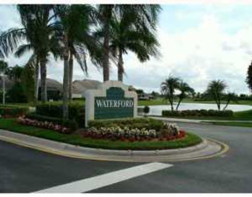 3 bedrooms & 2 bath, with 2-car garage. Glass enclosed lanai.  Incredible panoramic view of the water and golf course.  Volume ceilings.  Tile floors. Social membership available.