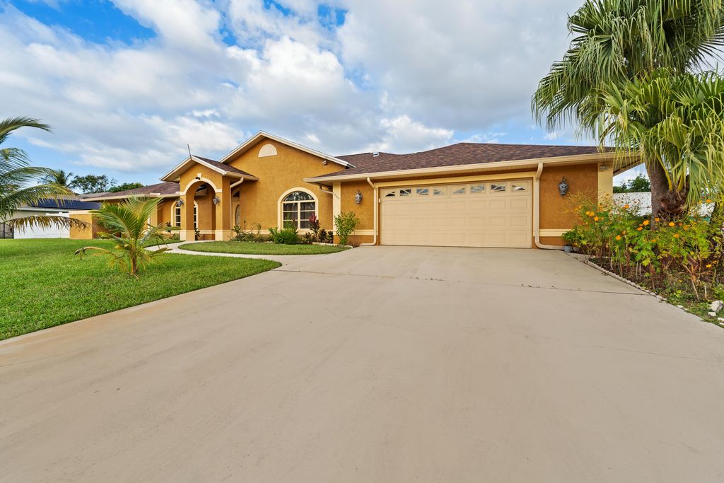 Photo of 1255 SE Naples Lane, Port Saint Lucie, FL 34983 (MLS # R11138166)