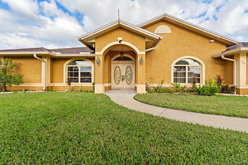 Photo of 1255 SE Naples Lane, Port Saint Lucie, FL 34983 (MLS # R11138166)