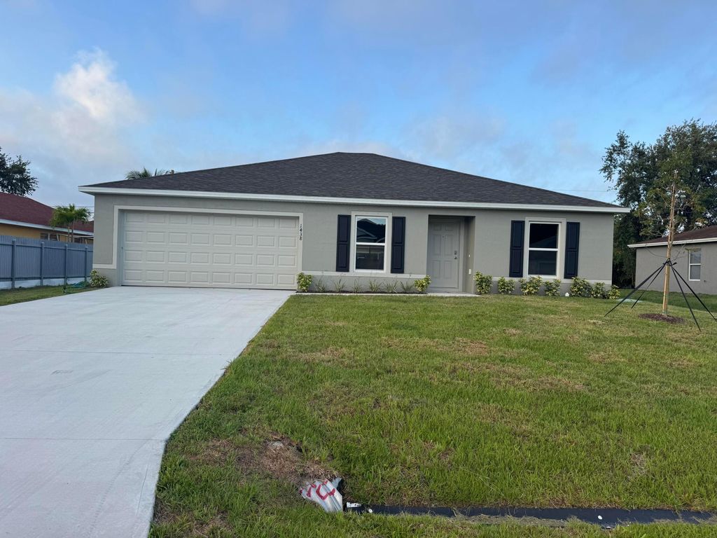 Photo of 1438 SW Goodman Avenue, Port Saint Lucie, FL 34953 (MLS # R11093361)