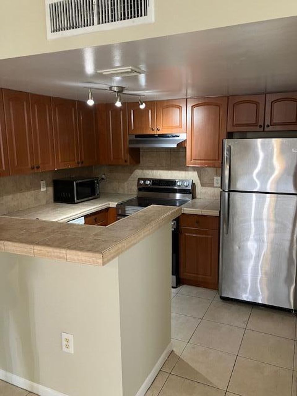 Photo of 1727 Village Blvd #111, West Palm Beach, FL 33409 (MLS # B26001030)