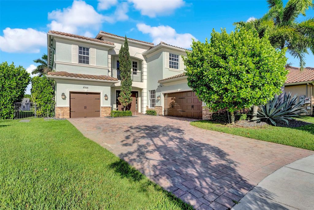 Photo of 8766 Miralago Way, Parkland, FL 33076 (MLS # F10515136)