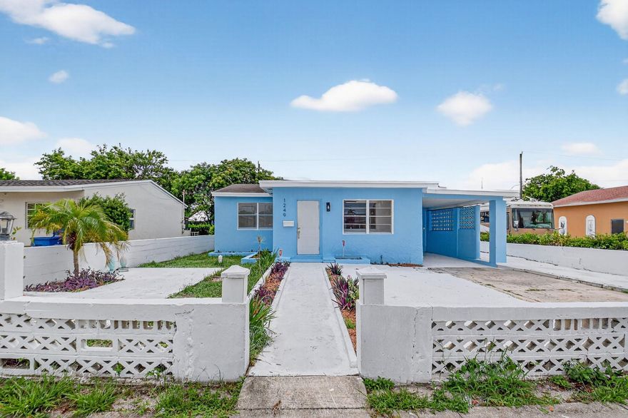 Completely renovated home with 4 bedrooms. NEW ROOF, NEW AIR CONDITIONER, new porcelain floors, new kitchen, bathrooms and LED lighting. Walk-in primary closet, laundry room, car port and more! A rare find.