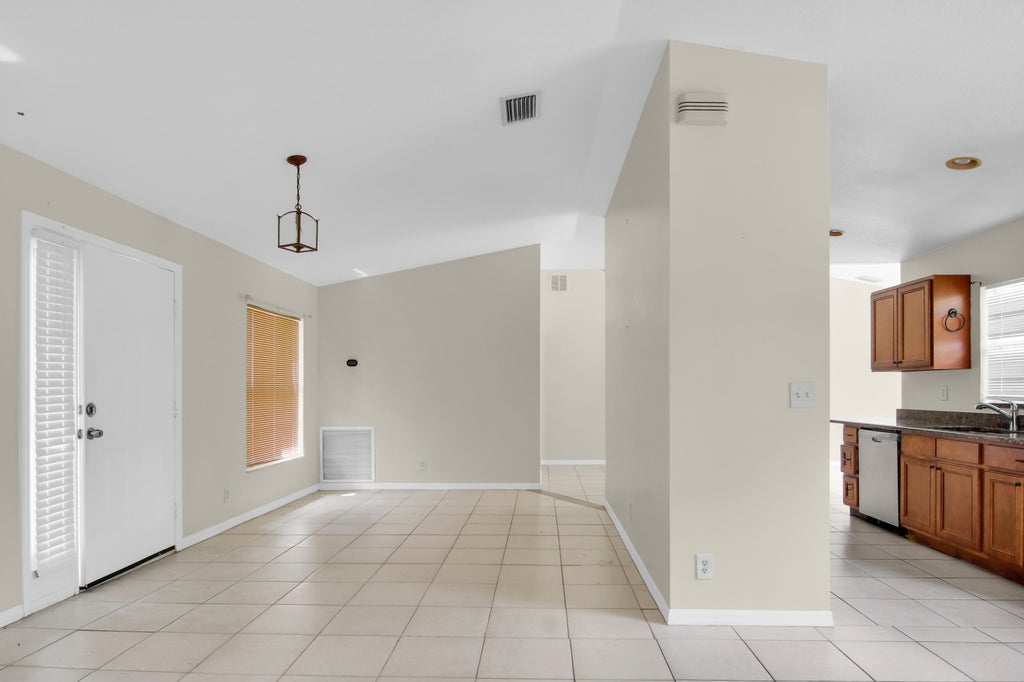 Photo of 1931 SW Fears Avenue, Port Saint Lucie, FL 34953 (MLS # B26076098)