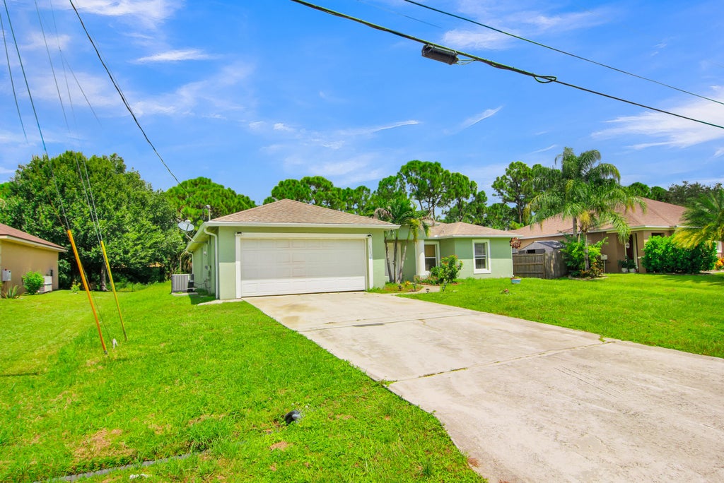 Photo of 1931 SW Fears Avenue, Port Saint Lucie, FL 34953 (MLS # B26076098)
