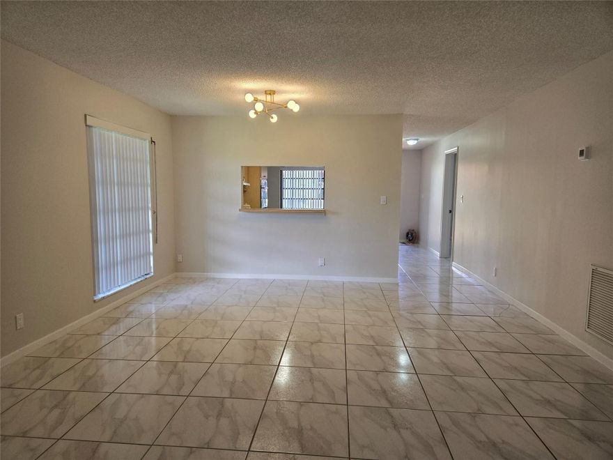 Enjoy this spacious 2 bedrooms, 2 baths villa located close to the beach! This corner unit features an open floor plan. Split bedrooms for added privacy. Tile flooring through out and has an enclosed patio/Florida room, can be used as an office. Private back yard, great for entertaining. Close to the pool.  This is an ALL age community. Low HOA Fees! Just minutes to Deerfield Beach, shopping, restaurants and major highways. This villa offers the perfect blend of comfort, convenience and leisure!!! A must see!!!