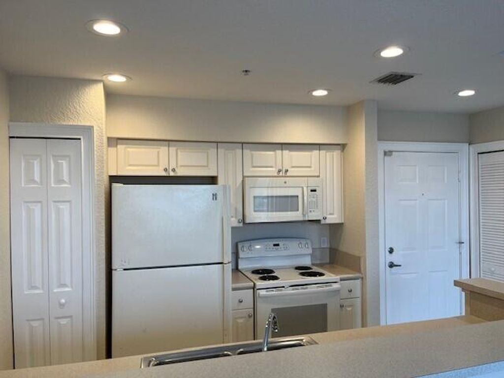 Photo of 4620 Pga Boulevard #303, Palm Beach Gardens, FL 33418 (MLS # R11036319)