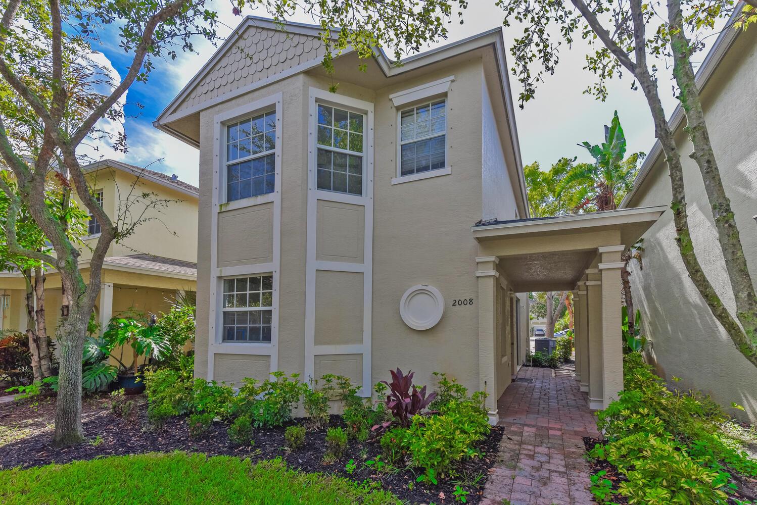 Come see this beautifully updated 3-bedroom, 2.5-bath home in the heart of Port St. Lucie's desirable East Lake Village! This home is loaded with upgrades, including a brand-new roof, newer water heater, fresh interior paint, and modern flooring throughout. Fall in love with the stunning new kitchen, featuring sleek cabinetry, granite countertops and updated bathrooms that add a touch of modern elegance. Enjoy the open floor plan and the low-maintenance lifestyle of this sidewalk-friendly community, just minutes from shopping, dining, top-rated schools, US-1, and the beautiful Treasure Coast beaches. This move-in-ready gem won't last - schedule your private tour today and make it yours!