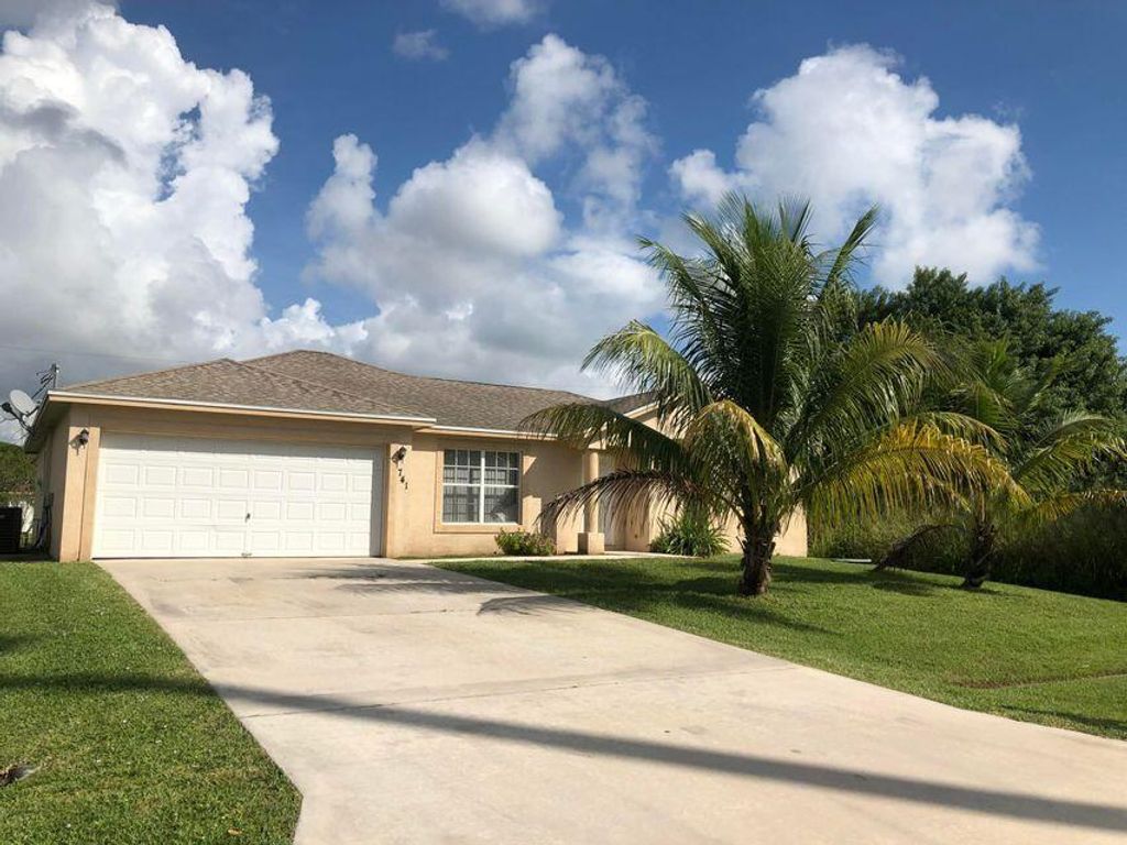 Photo of 741 SW Swan Avenue, Port Saint Lucie, FL 34983 (MLS # R10754796)