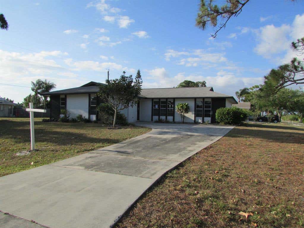 Photo of 592 SW Todd Avenue, Port Saint Lucie, FL 34983 (MLS # R10718036)