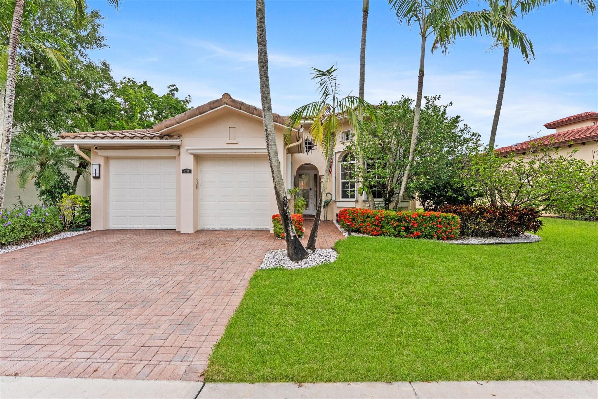 Immaculate & updated Heron Bay home with a prime lakefront setting! Tastefully updated with soaring ceilings and plenty of natural sunlight. The open-concept kitchen features stainless steel appliances, snack bar, and a breakfast nook spacious enough to serve as the main dining room. The oversized Formal dining room is equipped with glass French doors and can be used as a game room or media room. Beautiful primary suite with wood floors, tray ceilings and sitting area. Luxurious primary bath includes dual vanities, jacuzzi tub & glass enclosed shower. Other highlights include accordion hurricane shutters, 4 sets of French doors, built in closets in every room. Relax on the screened covered patio while taking in the lush landscaping and peaceful water views from the expansive backyard.
