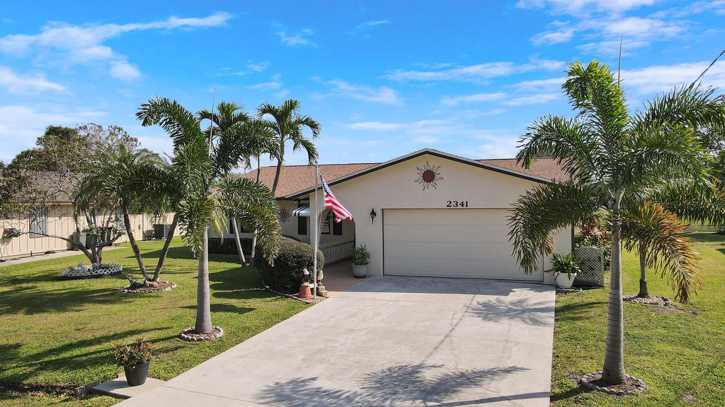 Photo of 2341 SE Leithgow Street, Port Saint Lucie, FL 34952 (MLS # R11034542)
