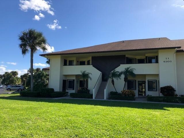Move-in ready CBS, 2/2, 2nd-floor, 1,224 Sq Ft end unit condo with private balcony and front door entry. Spacious rear screen porch overlooking a pond and the 5th fairway. Updated kitchen with Shaker-style cabinets, SS Appliances, granite countertops, wood paneled ceiling and large pantry. New water heater in 2020, W/D & refrigerator in 2021, and roof 2023. Updated baths, high grade engineered-wood, tile floors, plantation shutters, crown molding, and much more... Large storage closet and dedicated covered parking. Condo Community is owner-occupied (restricted rentals allowed) with clubhouse, heated pool, tennis, pickle ball, and abundant, open, peaceful green space. Close to Hobe Sound Beach, state parks, marinas, shopping, and many wonderful water-side restaurants.