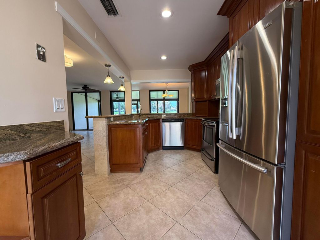 Photo of 717 Windermere Way, Palm Beach Gardens, FL 33418 (MLS # B26010425)