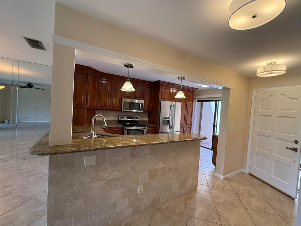 Photo of 717 Windermere Way, Palm Beach Gardens, FL 33418 (MLS # B26010425)