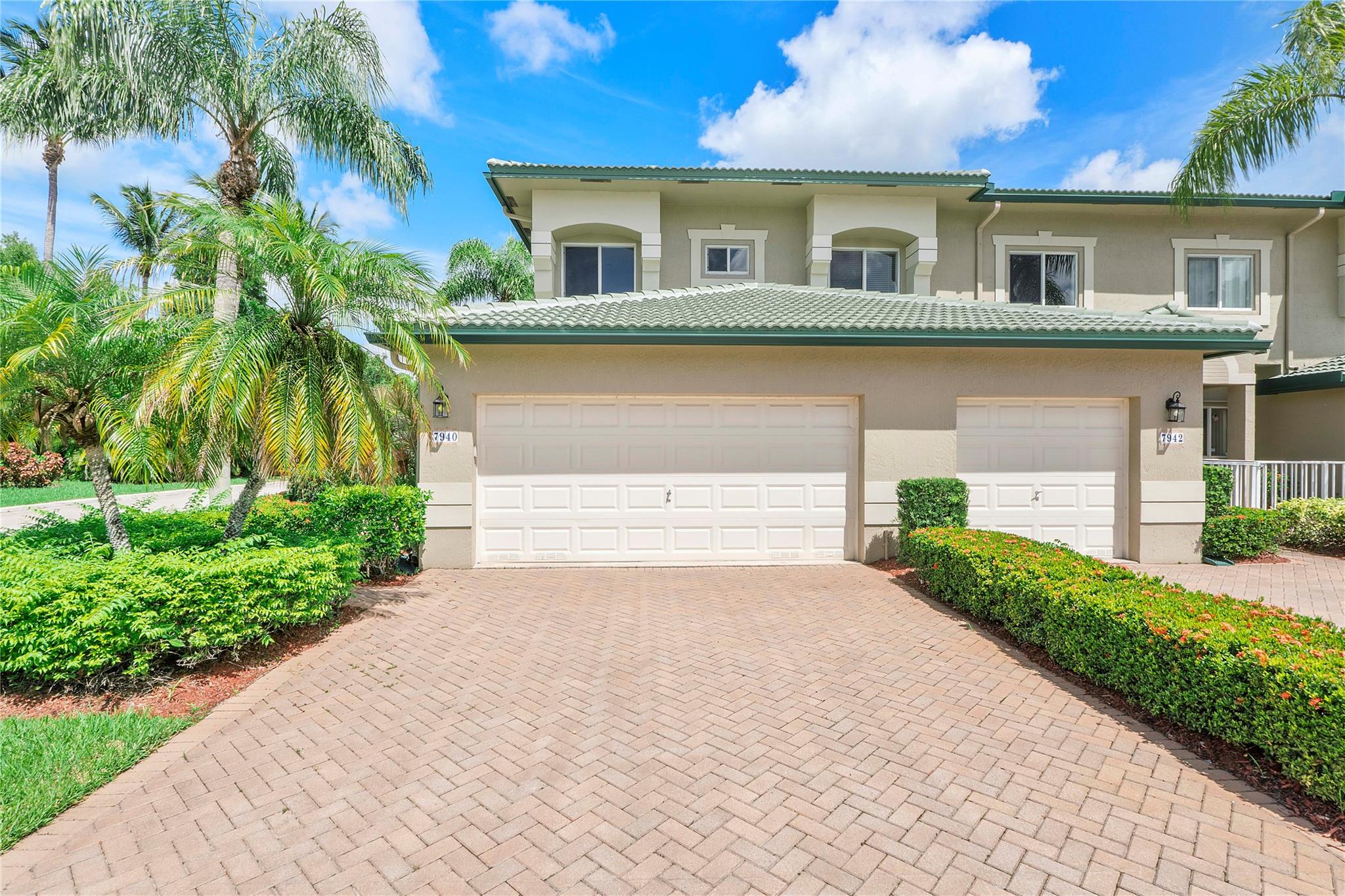 Enjoy resort-style living in this light-filled 3 bed, 2 bath corner coach home with a private elevator and 2-car garage, located in a sought-after 55+ community. Designer upgrades throughout include an upgraded kitchen, double wine refrigerator, upgraded bathrooms, and spacious living/dining areas. The primary suite offers dual sinks, a walk-in closet, an oversized secondary closet, and a new 2025 roof. The community features resort-style amenities: clubhouse, indoor/outdoor heated pools, tennis, pickleball, theater, fitness and art classes, all within a gated setting with 24-hour security. One occupant must be 55+. All assessments paid in full. Move-in ready!