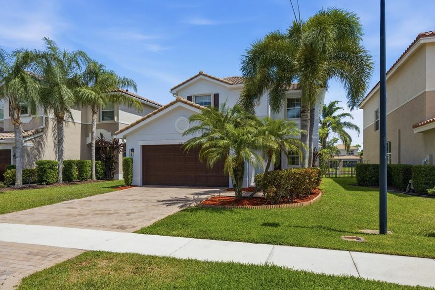 Beautifully maintained 4-bedroom, 3-bath lakefront home with a fenced yard—perfect for everyday living and entertaining. The open layout features a spacious great room, dining area, and covered patio. The kitchen impresses with granite countertops, tiled backsplash, under-cabinet lighting, snack bar, and breakfast nook. The primary suite offers dual walk-in closets, double vanities, and a walk-in shower. Diagonal tile flooring, an upgraded staircase, and abundant natural light enhance the home. Relax outdoors on the covered patio with peaceful lake views.