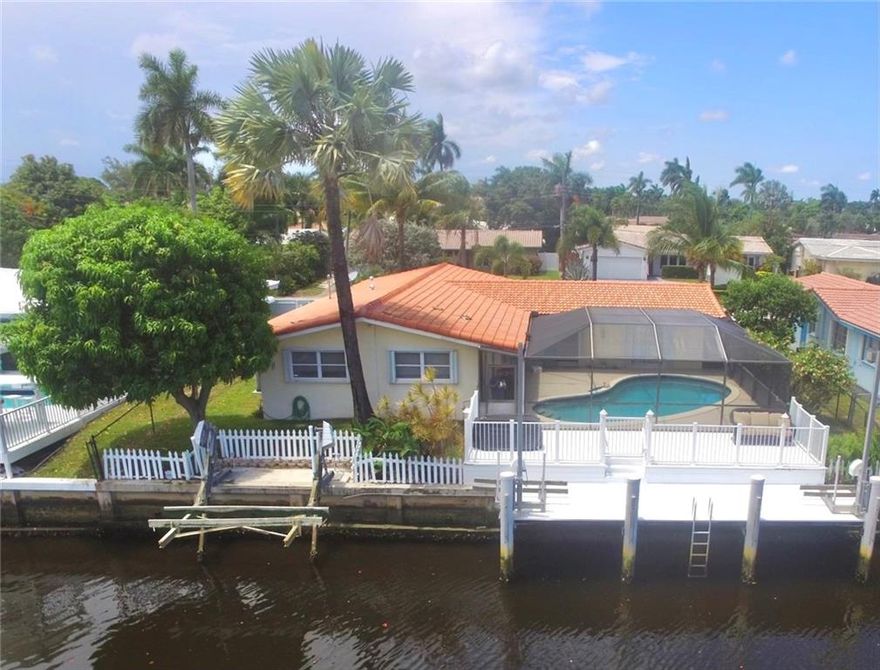 WELCOME HOME! Here you have an amazing opportunity to own this beautiful 3 bed, 2 bath WATERFRONT/OCEAN ACCESS pool home located in the desirable Coral Ridge Isles of East Fort Lauderdale! This gem boasts of tile and wood floors, beautiful crown molding and granite throughout with an abundance of natural light.  In the backyard we have an amazing two tier dock with breath taking water views of the Rio Reynolds Canal, complete with two Jet Ski lifts and one boat lift! Additional features include hurricane shutters, Impact front door and garage door, screened waterfront pool, and lush landscaping! Amazing neighborhood with 9/10 Floranada public elementary and top rated Pine Crest within walking distance! New Roof along with many other updates in 2020! This opportunity won’t last long!