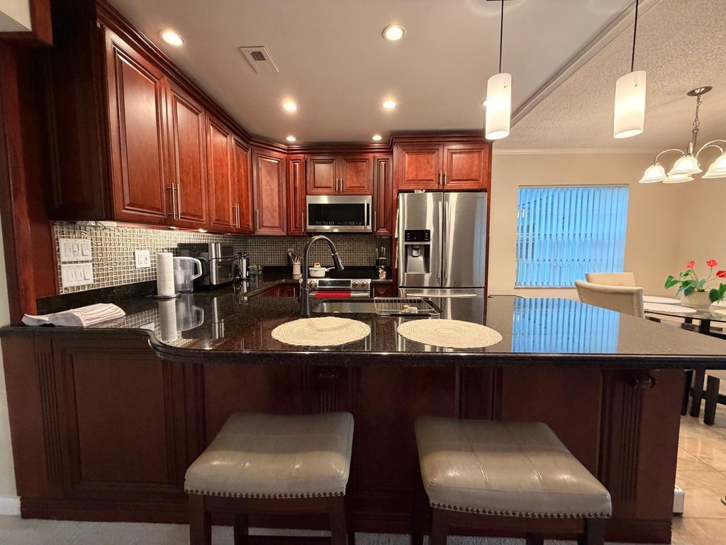 Photo of 43 NORMANDY A #43, Delray Beach, FL 33484 (MLS # B26069518)