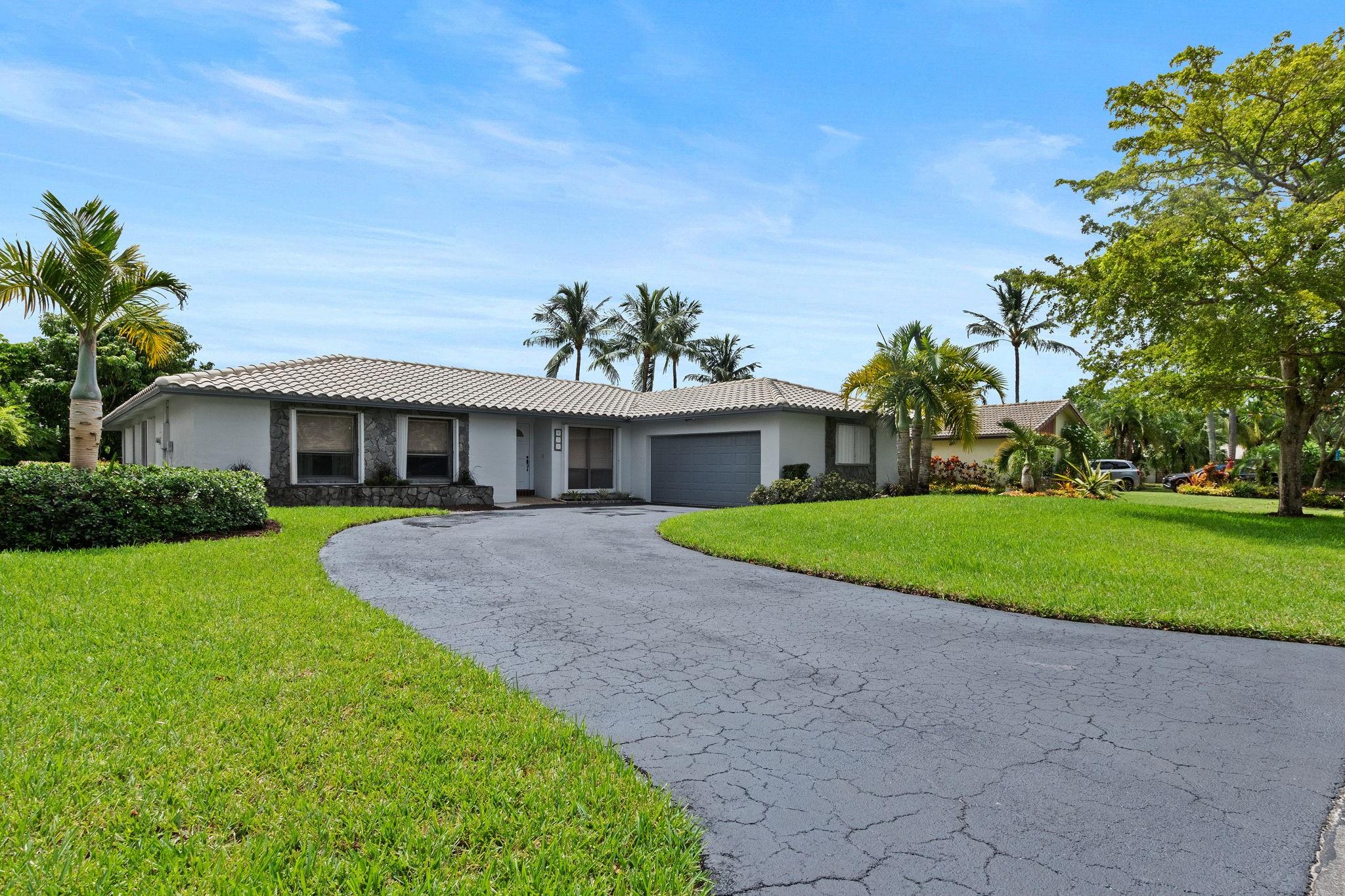 This beautiful 4/2 pool home is located in the highly sought-after Oakwood neighborhood of Coral Springs. With a bright open floor plan and large living spaces it's perfect for your family! The home has full hurricane coverage, a large newly topped driveway, gutters, new landscaping and mulch, vinyl floors, Newer AC and Water heater, upgraded baths and fresh paint throughout. The backyard is ready for all the parties; with a screened in patio that allows for both sitting and eat-in space and the pool and yard fenced in for added security. Coral Springs is full of parks, great restaurants and shopping, schools and is minutes from all major highways, Sawgrass Mills Mall, Amerant (panthers) stadium, and the beaches! Impeccably kept and ready for it's next family, this won't last!