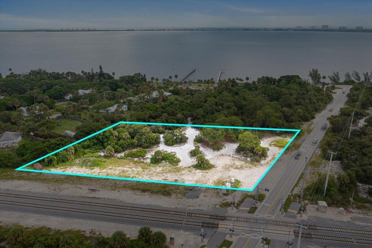 This 1.70-acre lot offers the perfect setting for a custom luxury home. Located in a sought-after area, it provides privacy while being just minutes from upscale shopping, golf, and dining. The spacious parcel is ideal for creating an elegant estate with room for outdoor amenities like a pool or garden. Surrounded by natural beauty, this prime location offers a rare opportunity to build your dream home in Port St. Lucie's most desirable setting.