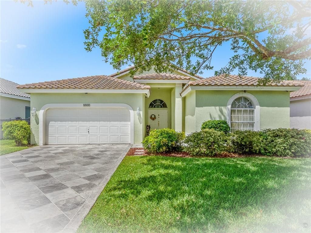 Photo of 5937 NW 73rd Ct, Parkland, FL 33067 (MLS # F10278472)
