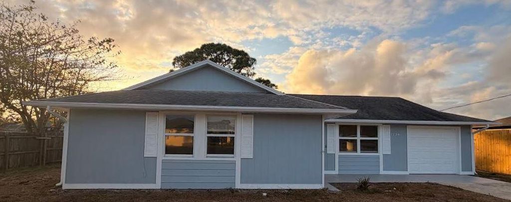 Photo of 1734 SW Carolina Street, Port Saint Lucie, FL 34953 (MLS # R11164453)