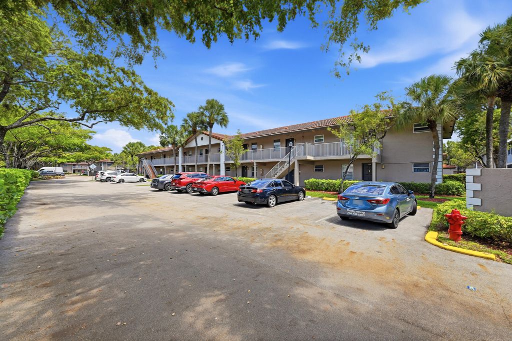 Photo of 8840 Royal Palm Boulevard #206-7, Coral Springs, FL 33065 (MLS # B26039646)