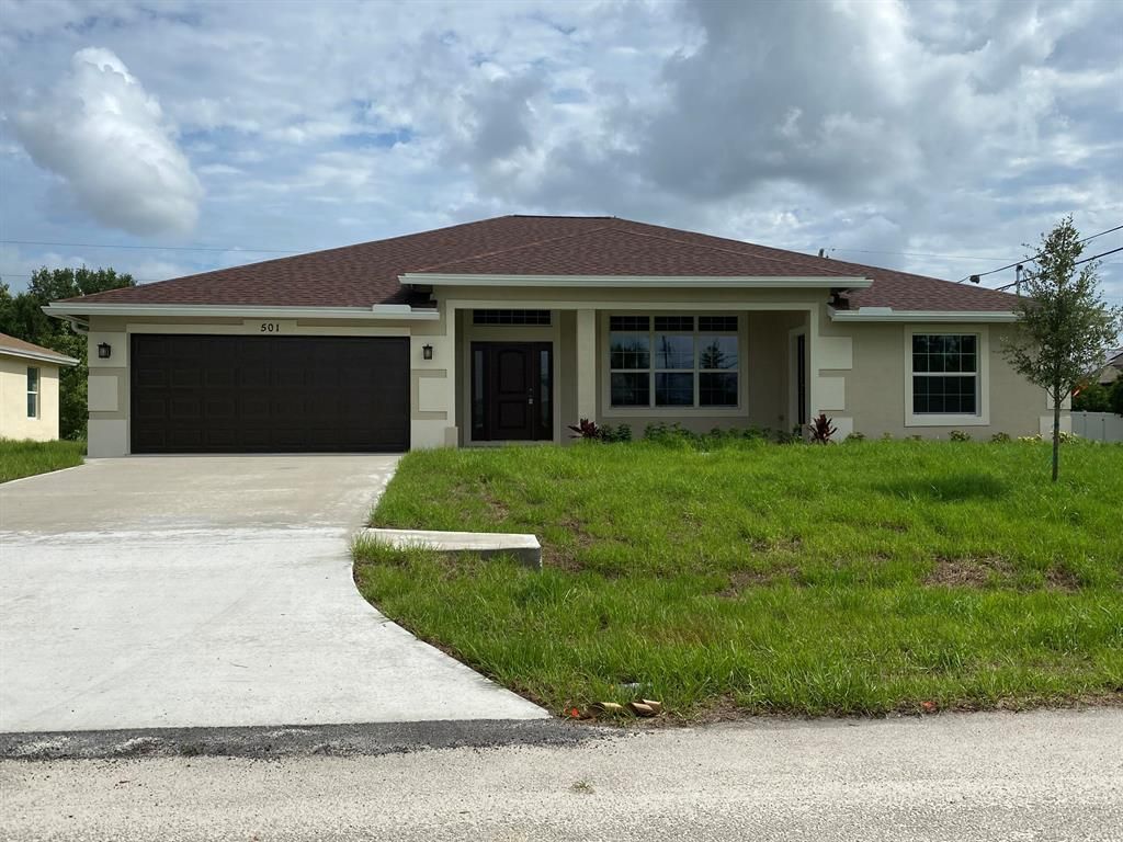 Photo of 501 SW Laconic Avenue, Port Saint Lucie, FL 34953 (MLS # R10726406)