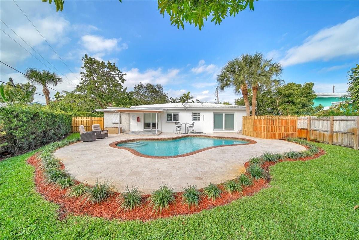Perfect Fort Lauderdale Home! Beautiful 2-bedroom, 2-bath pool home, each bedroom with its own en-suite. Just 2 miles from the beach and minutes to downtown. This charming property offers the ideal balance of peace and convenience, featuring a spacious layout, an inviting living area, and a large, shaded backyard — perfect for relaxing or entertaining. Enjoy sunny days by your private pool in a lush, tree-filled setting. Impact windows offer peace of mind, and the oversized lot provides room to expand or personalize. Located near top shopping, dining, nightlife, and with easy access to major highways and the airport.