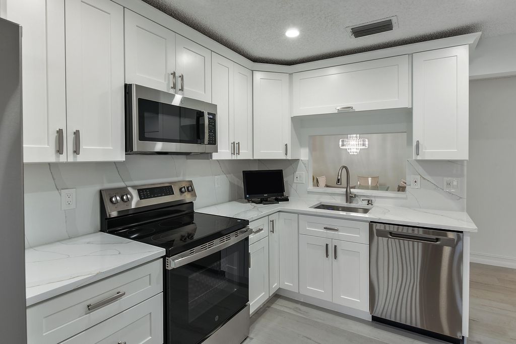 Photo of 15342 Lakes Of Delray Boulevard #98, Delray Beach, FL 33484 (MLS # R11156964)