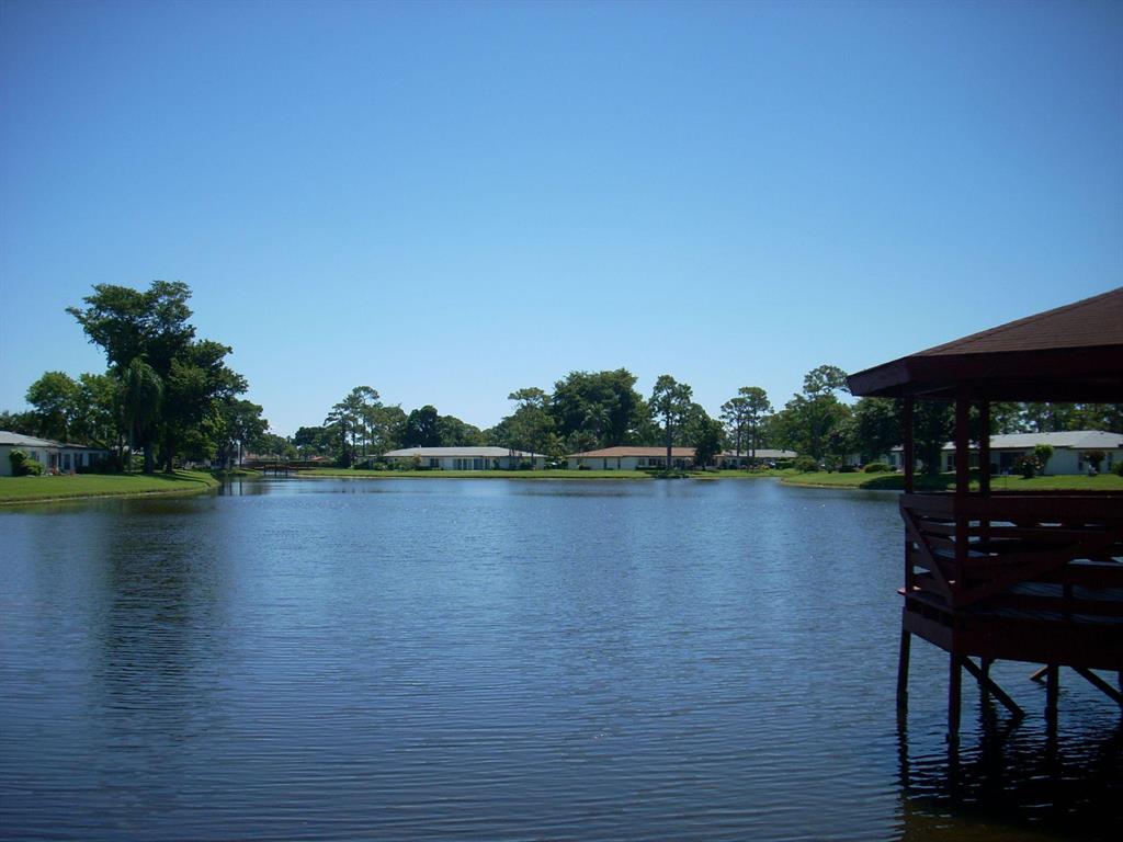 STUNNING LAKE FRONT VILLA is Newly Renovated. NEW April 2020 Rheem Air conditioner. An Eat-In Kitchen Features NEW March 2020 Samsung Appliances, contemporary Cabinets, Counters and Backsplash.Enjoy the Picturesque Lake in the comfort of the air conditioned glass enclosed Patio that is also a Practical Bonus Room. Another 190 sq. ft.outside patio can be added along the back of unit. Both bathrooms have top notch renovations. The Large EnSuite Master Bedroom has 2 walk-in closets. Convenient Spilt Bedrooms. Maytag Washer and Dryer.New Gorgeous floor Tile, Paint, Lighting and Ceiling Fans. Come seemany more upgrades. Villa is vacant and is Exceptionally Clean. Furniture is Negotiable. Assigned Parking at your front door. Just steps to Pool and Tennis. Feel at Home in Peaceful Bridgeview