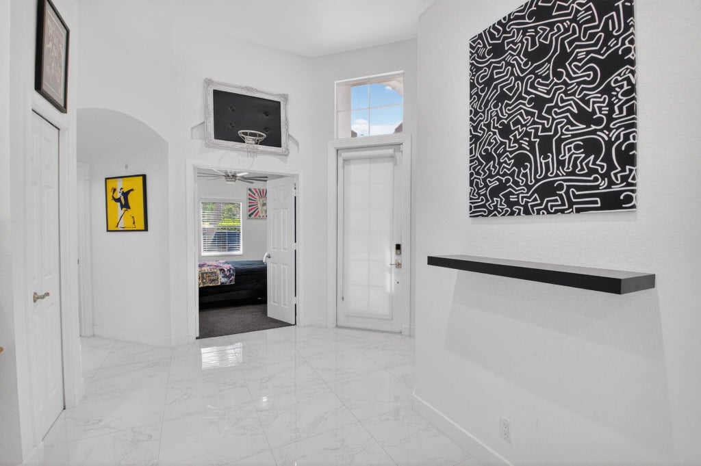 Photo of 6439 NW 43RD Terrace, Boca Raton, FL 33496 (MLS # B26061226)